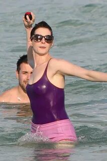 Anne Hathaway in Swimsuit and Shorts at a Beach in Miami