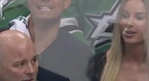 Incredibly Busty Woman Seated Behind Dallas Stars Bench Stol