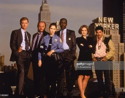 The cast of the television police drama 'NYPD Blue' pose on 