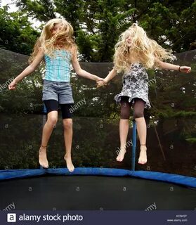 Two Girls Bouncing On Trampoline Stock Photos & Two Girls Bo