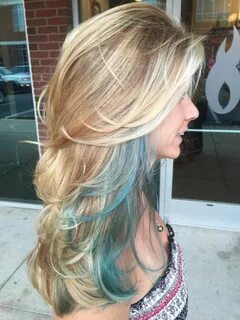 Long layers blonde balayage with a teal streak Teal hair hig