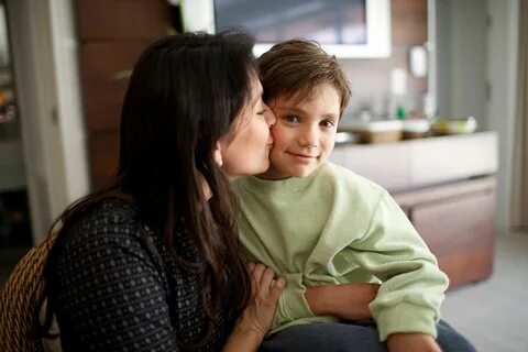 Mother Kissing Son’s Cheek