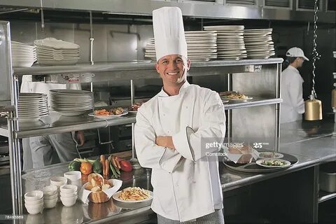 Chef Posing In Kitchen Of Restaurant High-Res Stock Photo - 