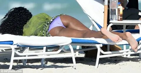 Kelly Rowland covers up fantastic bikini body to enjoy kicka