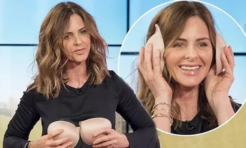 Trinny Woodall cups her chest with a bra in cheeky This Morn