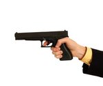 hand-in-a-business-suit-holding-a-pistol159201.jpg