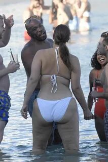 Ashley Graham In a white bikini at the beach with friends in