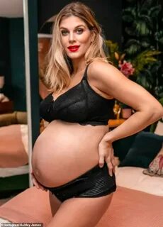 Ashley James displays her baby bump in a tan jumper as she g