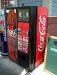 Coca Cola Vending Machine A Coke vending machine with roun. 
