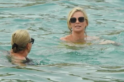 Charlize Theron - In a yellow swimsuit in Cabo San Lucas-01 