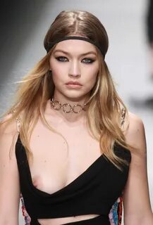 Gigi Hadid showing her bare boob on a runway at the Versace 