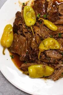 A serving of Instant Pot Mississippi Pot Roast on a plate Po