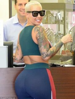 Amber Rose showcases her robust rear in tight workout pants 