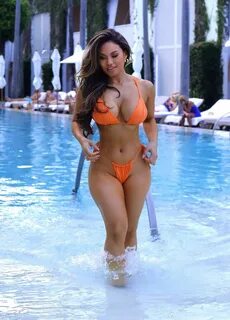 Celebrity Bikini - Daphne Joy In a Orange Bikini at the Pool