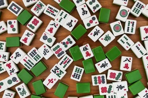 Tiles for Mahjong. Red Dragon on the Hand Stock Photo - Imag