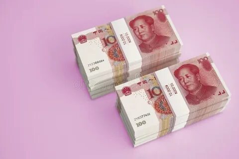 Stacks of Chinese 100 Yuan Bills and 100 Dollar Bills. Stock