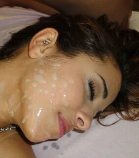 Sleeping brunette gets covered with cum porn photo