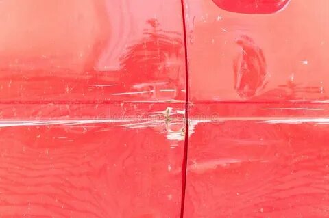 Red Scratched Car with Damaged Paint in Crash Accident or Pa