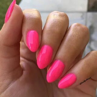 Bright neon pink almond nails. Perfect summer or vacation na