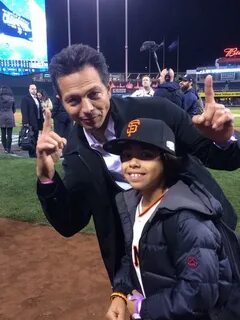 SFGiants fan Benjamin Bratt celebrates with his son. Champio