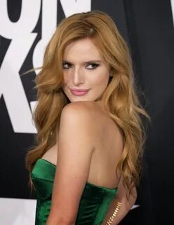 Bella Thorne bares cleavage in a strapless dress at the 2014