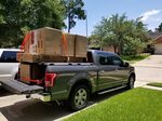 A Heavy Duty Truck Bed Cover On A Ford F150 Cargo loaded o. 