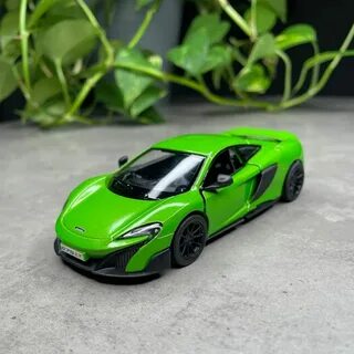 дверями представляет собой точную копию модели McLaren 675LT (Макларен).