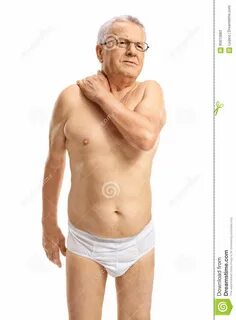 Зрелый человек в нижнем белье страдая от боли шеи Стоковое И