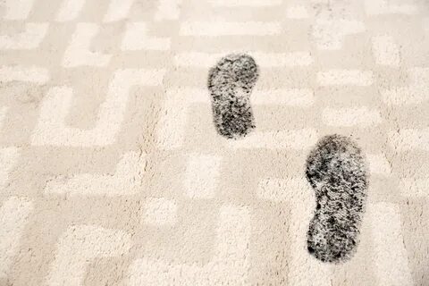 Muddy footprints on carpet - SERVICEMASTER TWIN CITIES