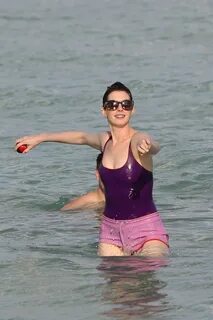 Anne Hathaway in a Swimsuit and Shorts at a Beach in Miami -