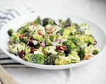 This broccoli salad with bacon is dressed up cranberries, su