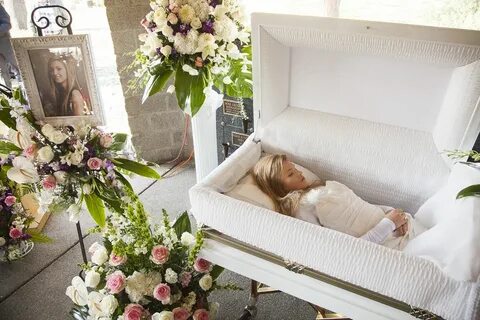Liana Kotsura in her open casket during her funeral. Casket,