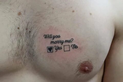 Man proposes to girlfriend with 'Will you marry me?' chest t