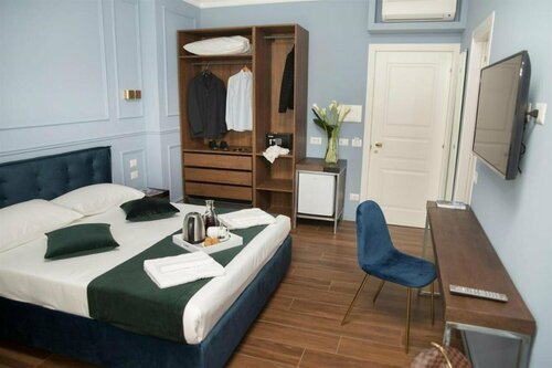 Гостиница Unicum Roma Suites в Риме