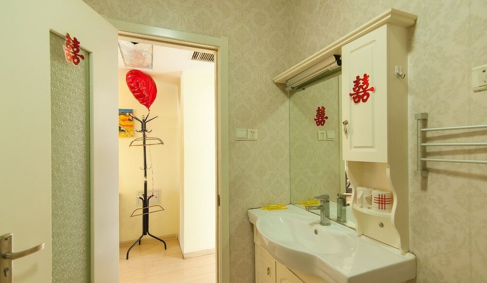 Фото Tianjin Xinyi Apartment Hotel