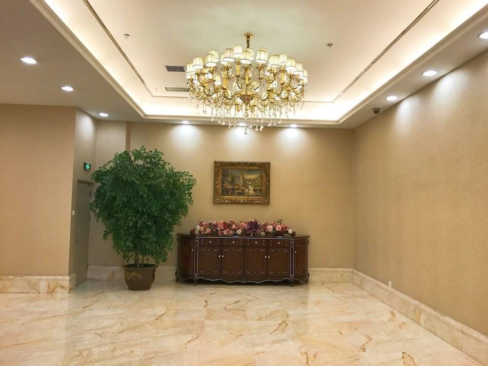 Фото Dalian Xuanya Apartment