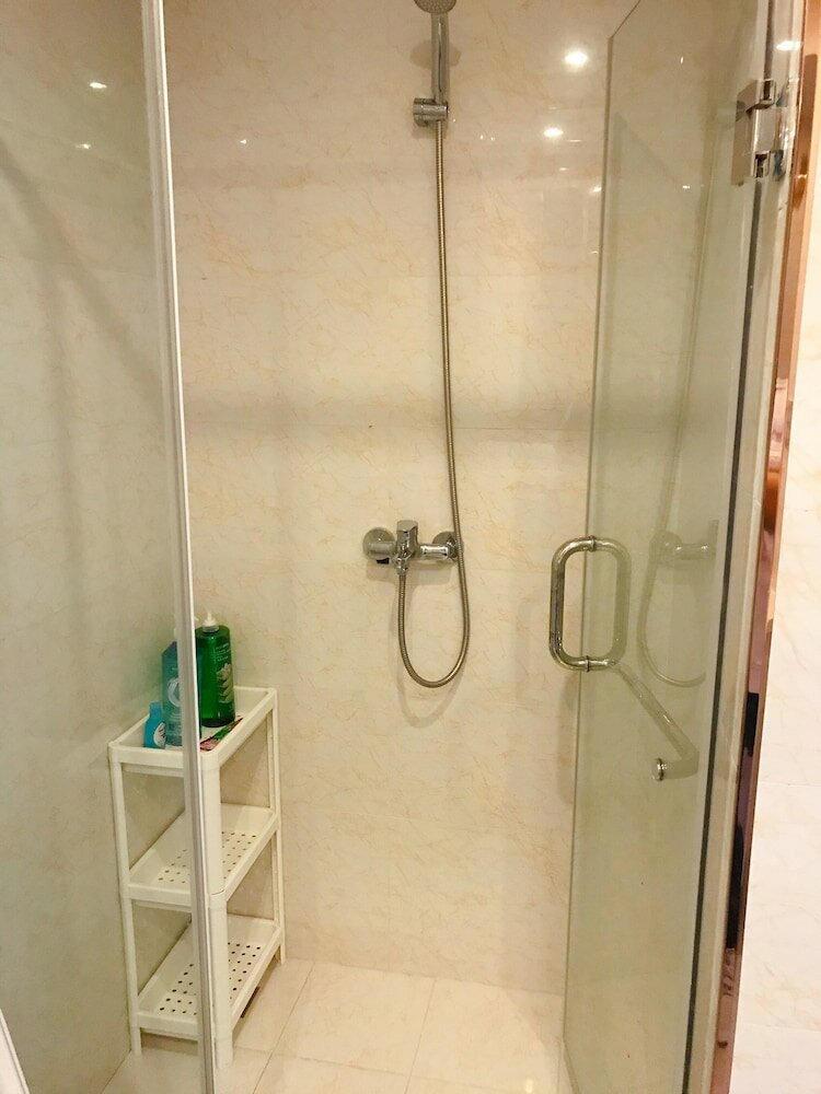 Фото Dalian Xuanya Apartment