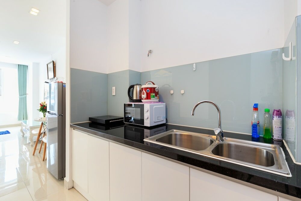 Фото Oyo 103 Airport Family Apartment