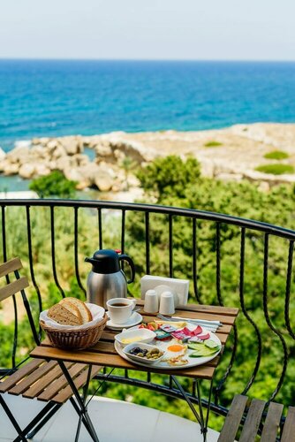 Гостиница Olivia Palm Hotel в Кирении