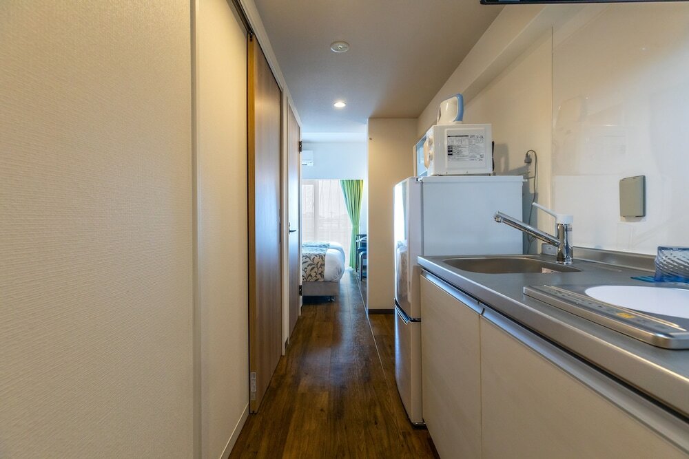 Фото Mr. Kinjo in front of Manza Beach