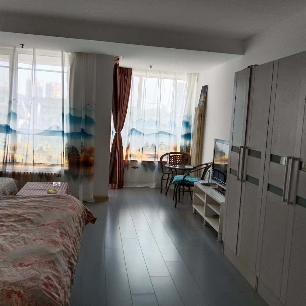 Фото Dalian Xiuzhu Building Apartment