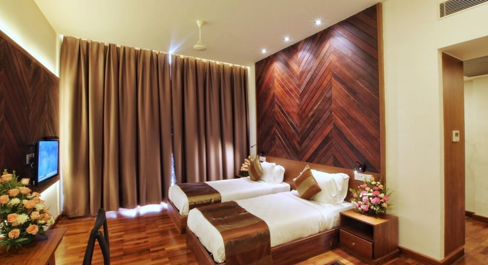 Фото Woodies Bleisure Hotel