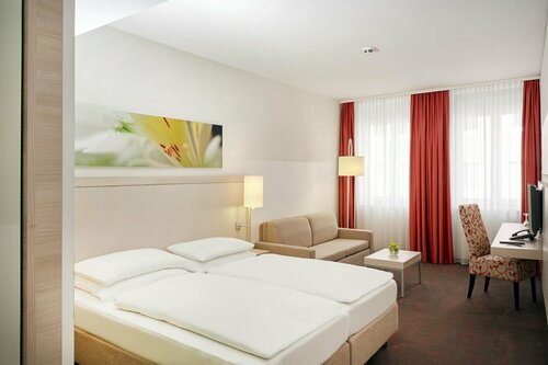 Гостиница H+ Hotel München в Мюнхене