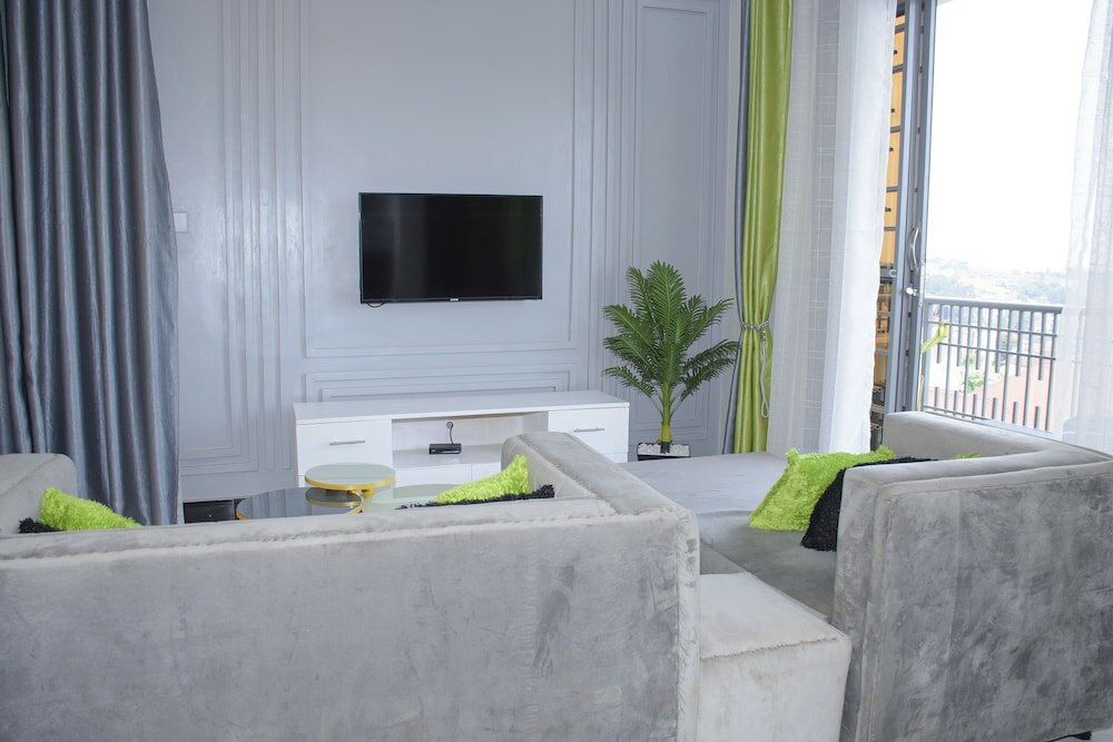 Фото Cozy Oasis Kyanja