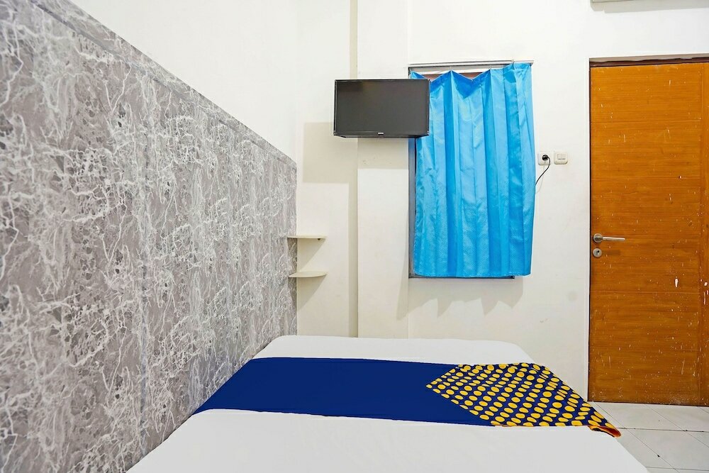 Фото Spot On 91360 Swk 68 Syariah