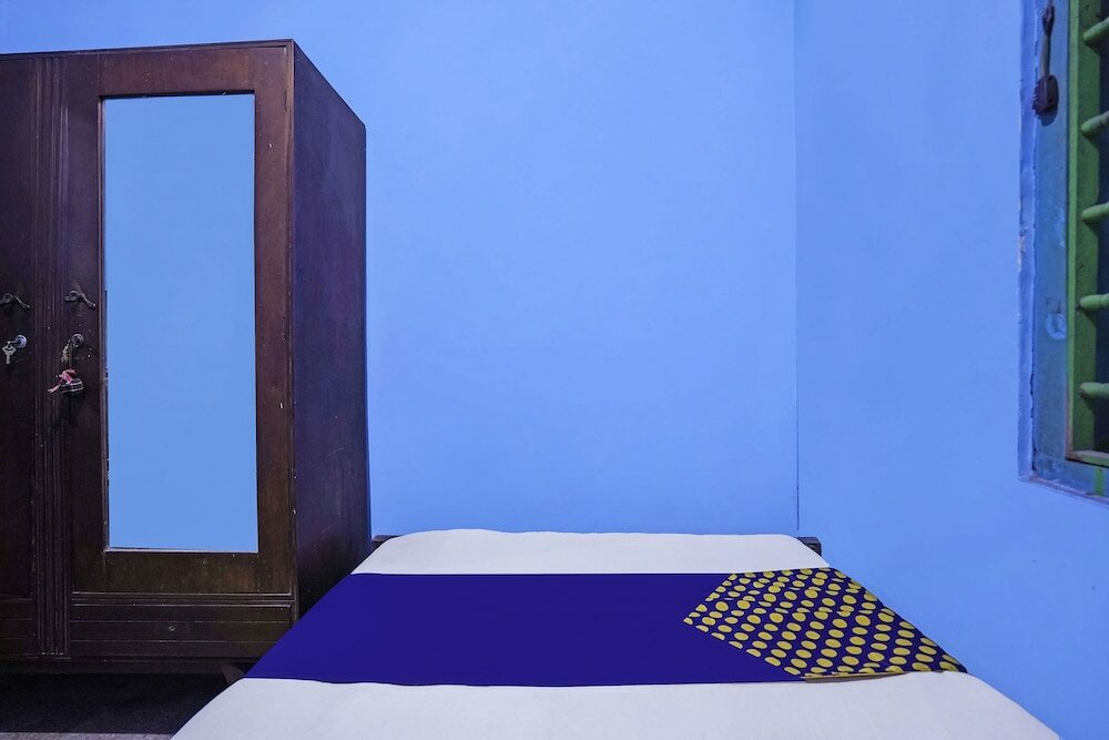 Фото Spot On 91859 Kost Budhe Syariah