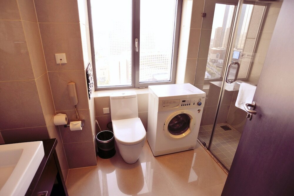 Фото Qingdao Housing International Hotel