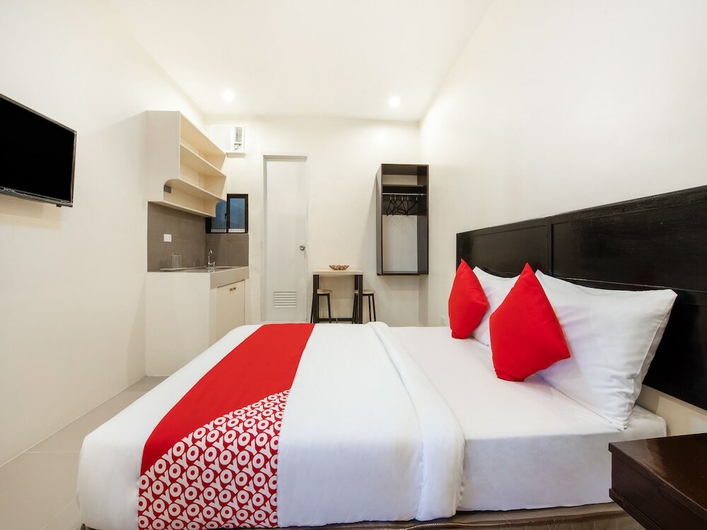 Фото Oyo 490 V-cat Apartelle