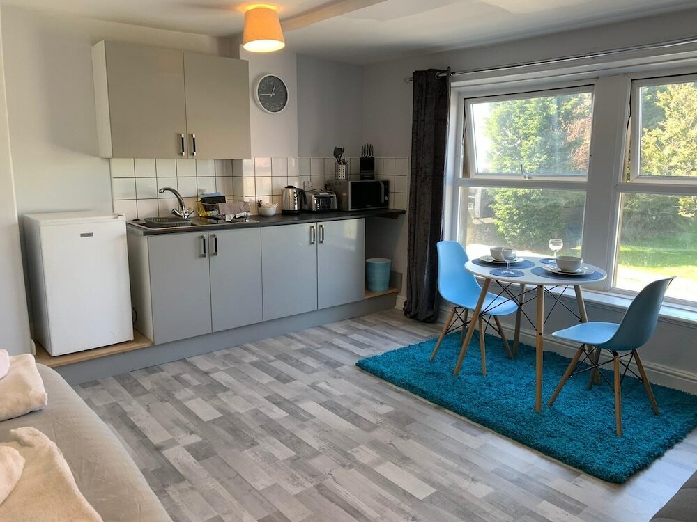 Фото Grey Stone Studio Apartments