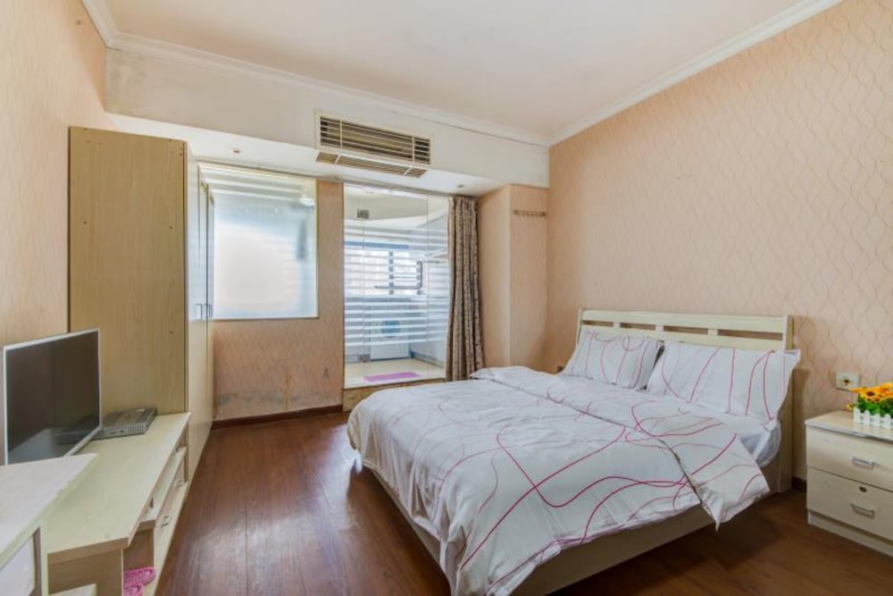 Фото Shenzhen Xinjia Business Apartment